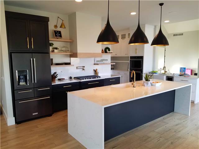 Painted cabinets - Quartz countertops - waterfall ends on the island